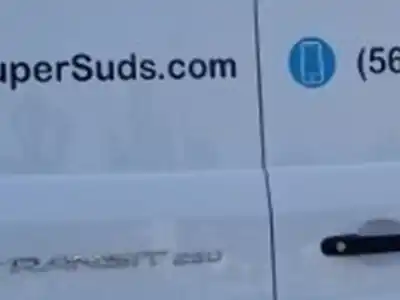 Super Suds Van with phone number on the side