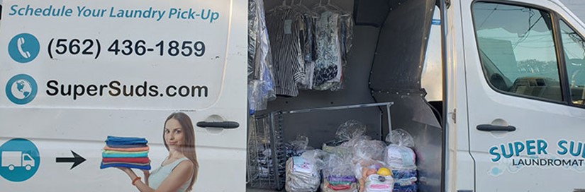 Super Suds Pickup Delivery Van with door open and laundry